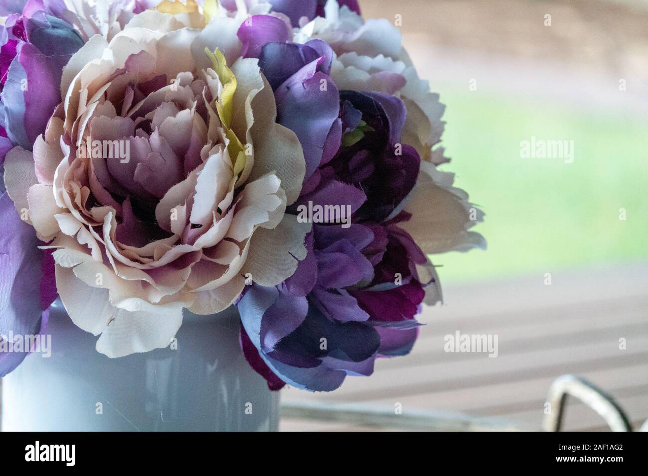 Pink Purple Fake Artificial Flowers In White Vase Stock Photo Alamy