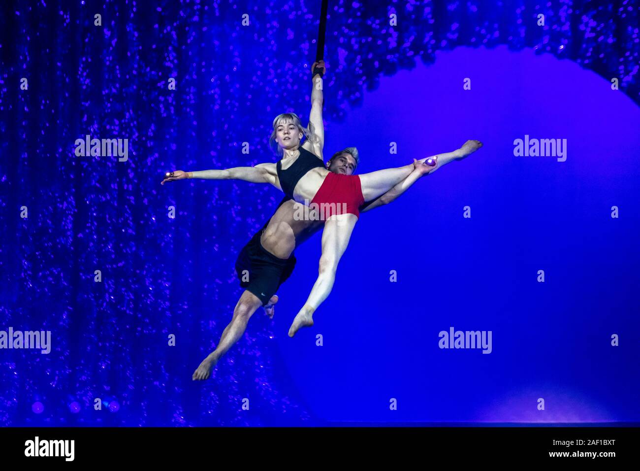 New York, USA,  11 December 2019.  Cirque du Soleil's Guillaume Paquin and Nicole Faubert perform the Aerial Duo Straps during the a rehearsal before tomorrow's opening for 'Twas the Night Before...  Cirque du Soleil's first ever Christmas show will debut at the Hulu Theater in Madison Square Garden on December 12, 2019. Credit: Enrique Shore/Alamy Live News Stock Photo