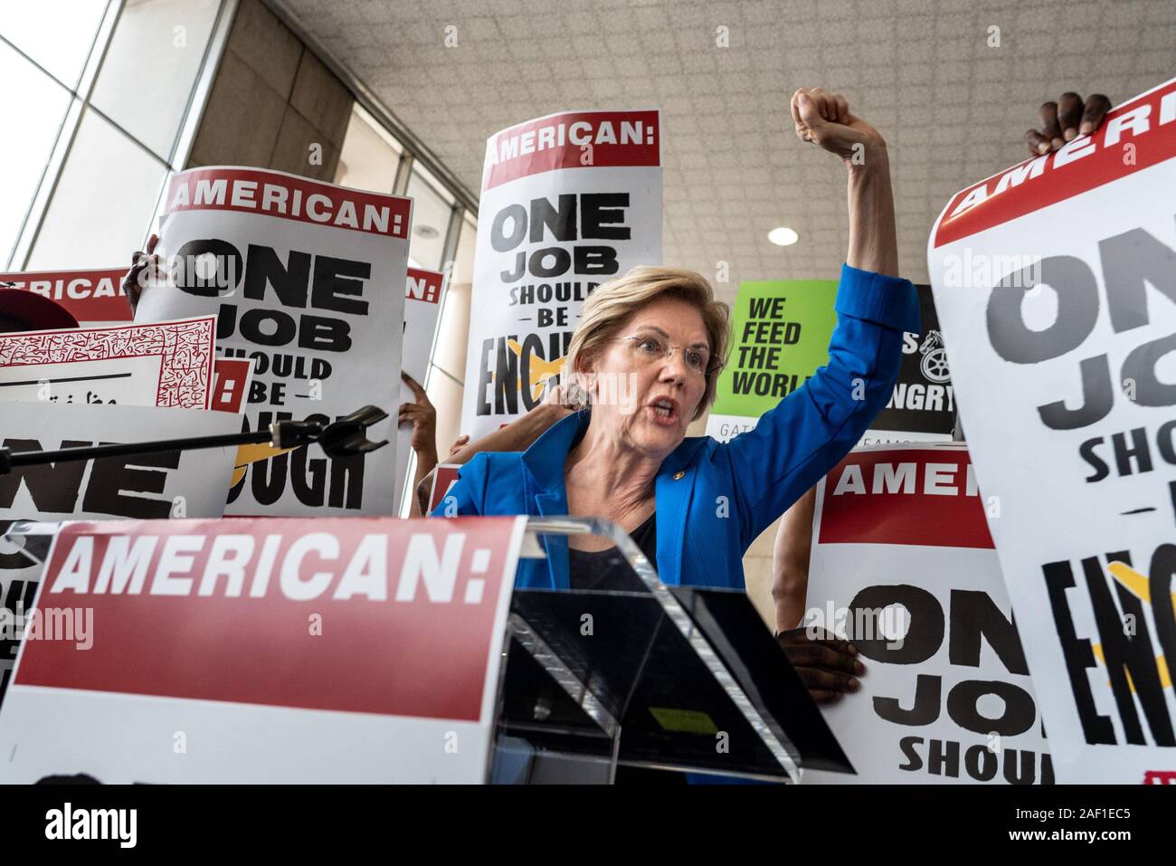 Arlington, United States. 12th Dec, 2019. Democratic presidential candidate hopeful Elizabeth Warren (D-MA) speaks to a crowd made up of mostly American Airlines workers demanding better pay and benefits at Reagan National Airport on July 23, 2019, in Arlington, Virginia. In a blog post to her Medium page titled 'The Coming Economic Crash and How To Stop It, Warren said, 'warning signs are flashing' for an economic downturn in 2019 or 2020. Photo by Ken Cedeno/UPI Credit: UPI/Alamy Live News Stock Photo