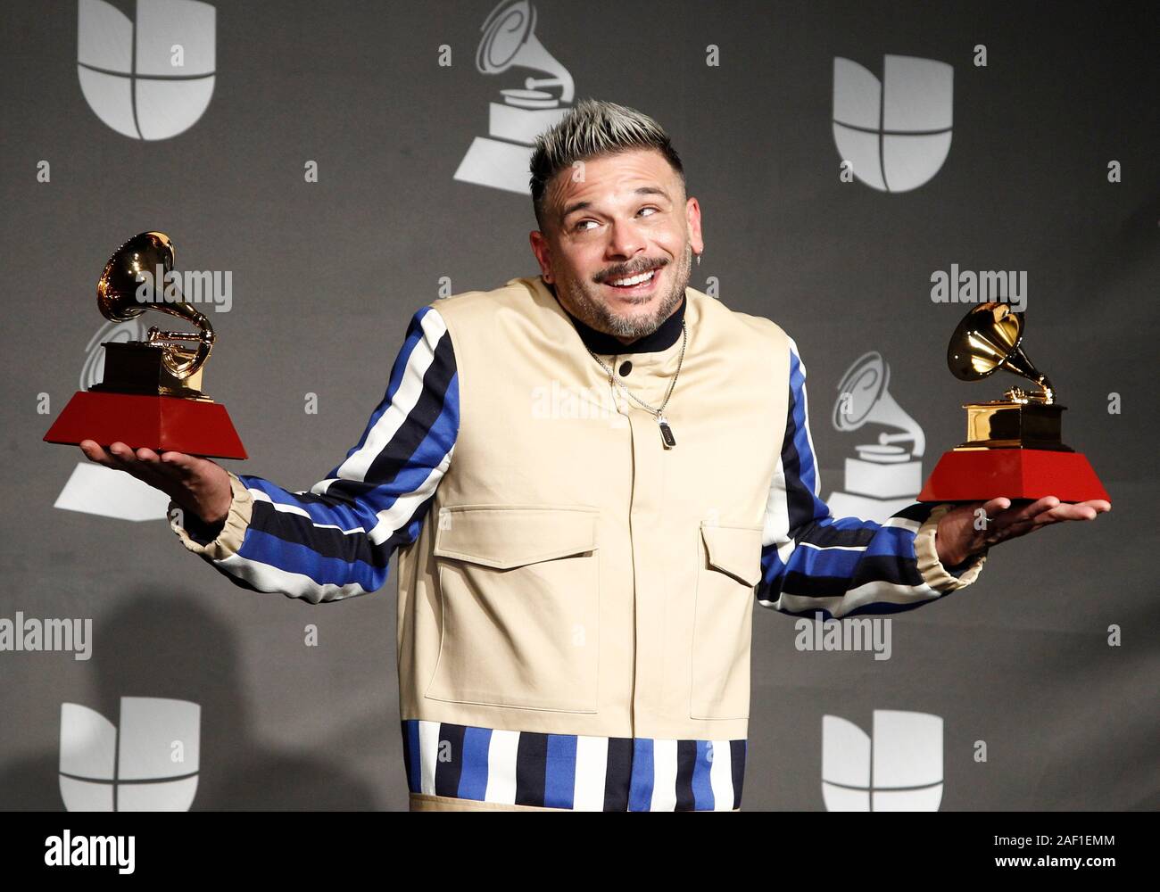 Las Vegas, United States. 12th Dec, 2019. Pedro Capo appears backstage with  the awards for best urban fusion/performance for "Calma (Remix)" and song  of the year for "Calma" during the 20th annual