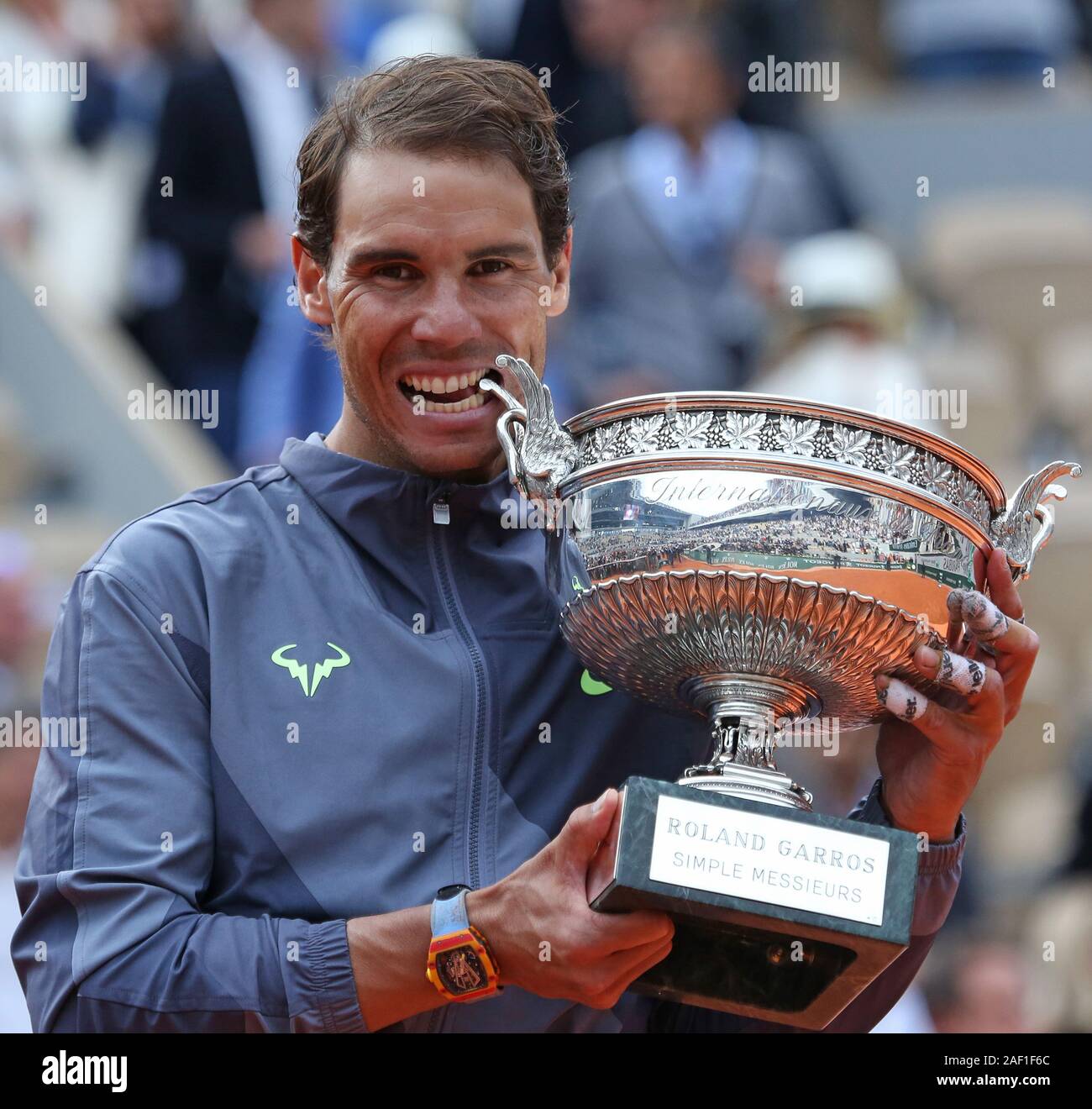 Paris, France. 12th Dec, 2019. Rafael Nadal of Spain bites the championship  trophy after winning his French Open men's final match against Dominic Thiem  of Austria at Roland Garros in Paris on