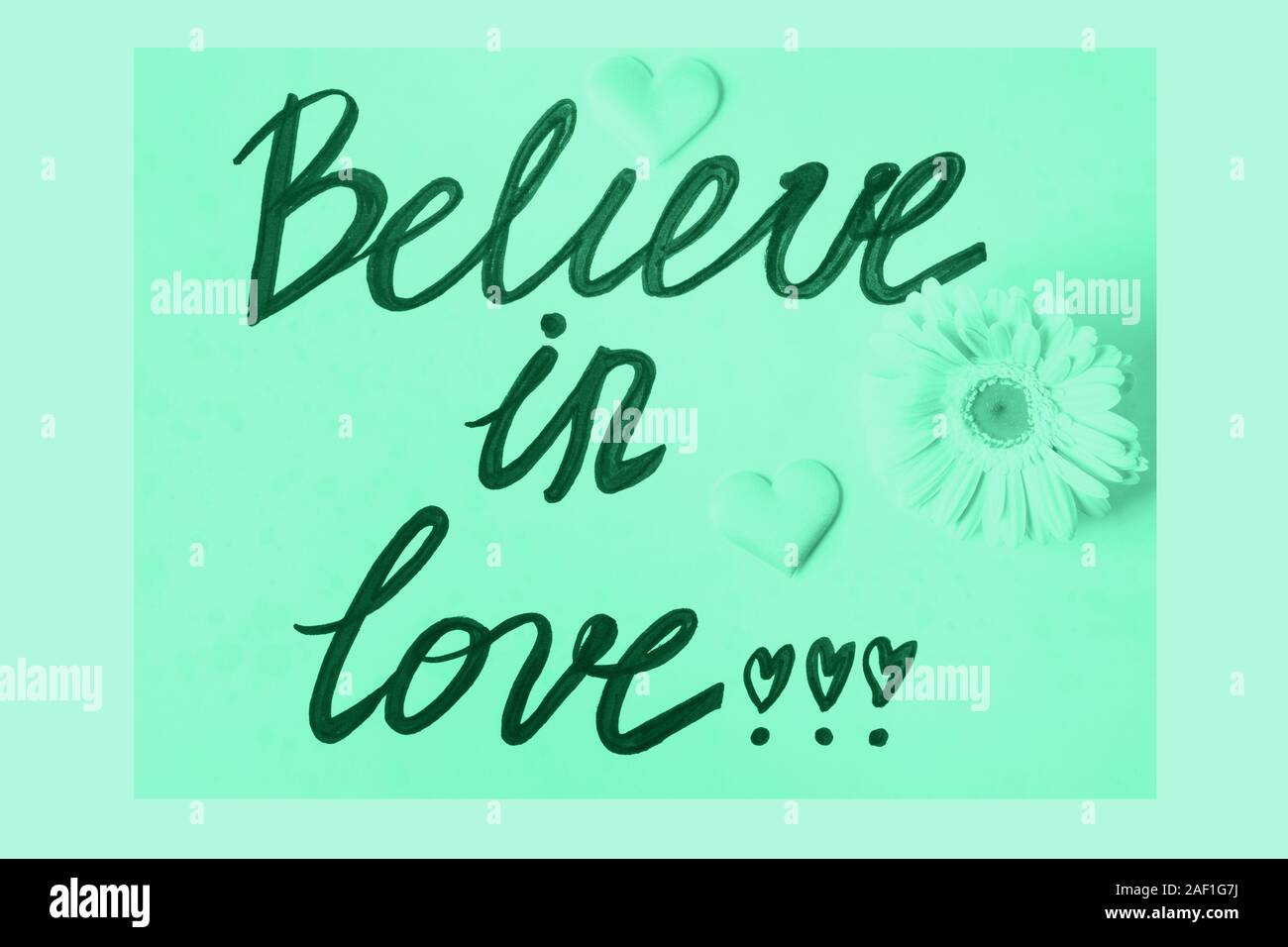 Believe in love written on mint green color of 2020 Stock Photo Alamy