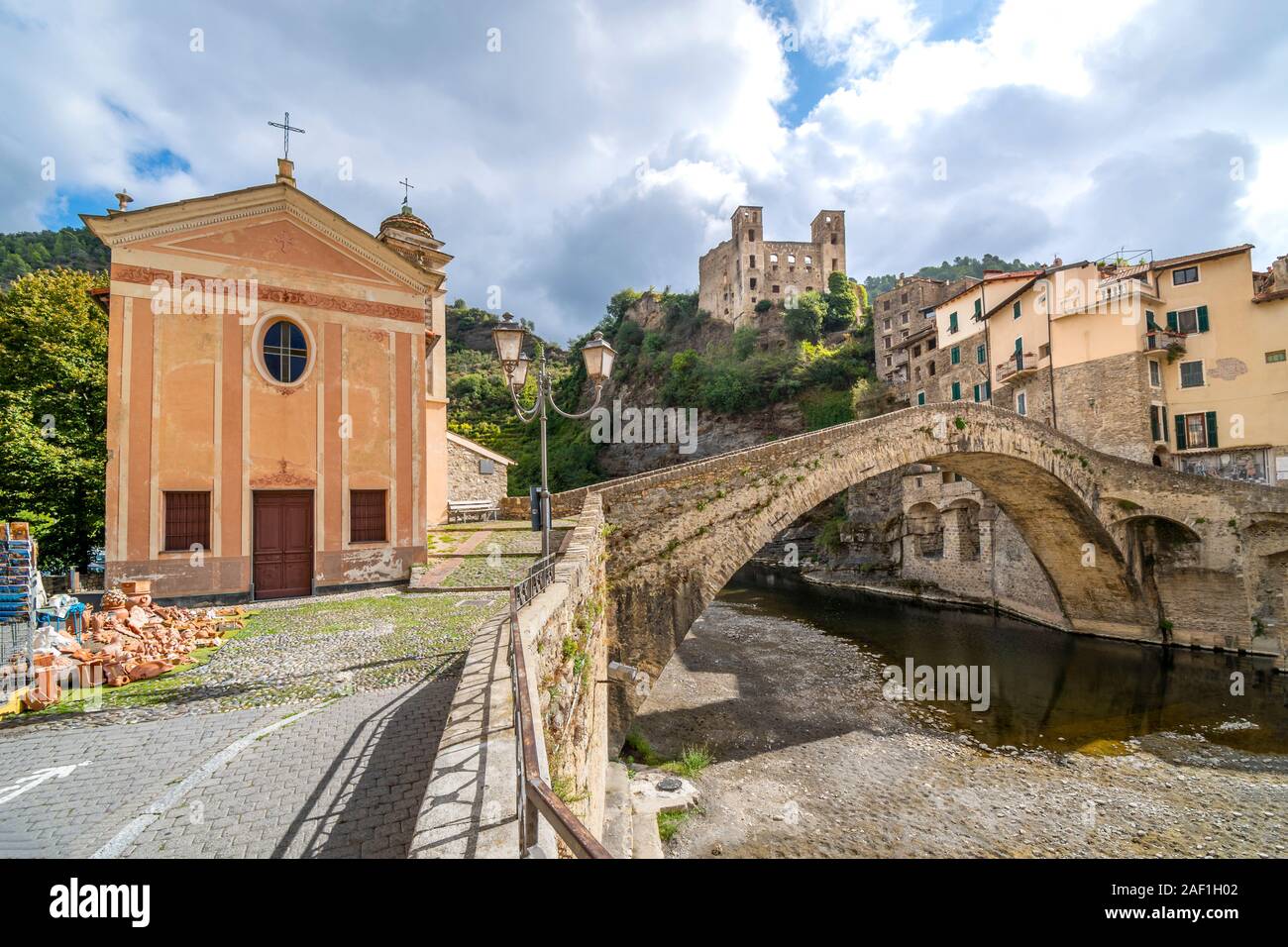 The famous, medieval Monet bridge with the Church of San Filippo next to it in the historic ancient hilltop city of Dolceacqua, Italy. Stock Photo