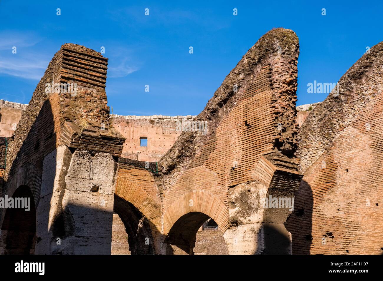 Walls and arches of the Colosseum or Coliseum, an oval amphitheatre in ...