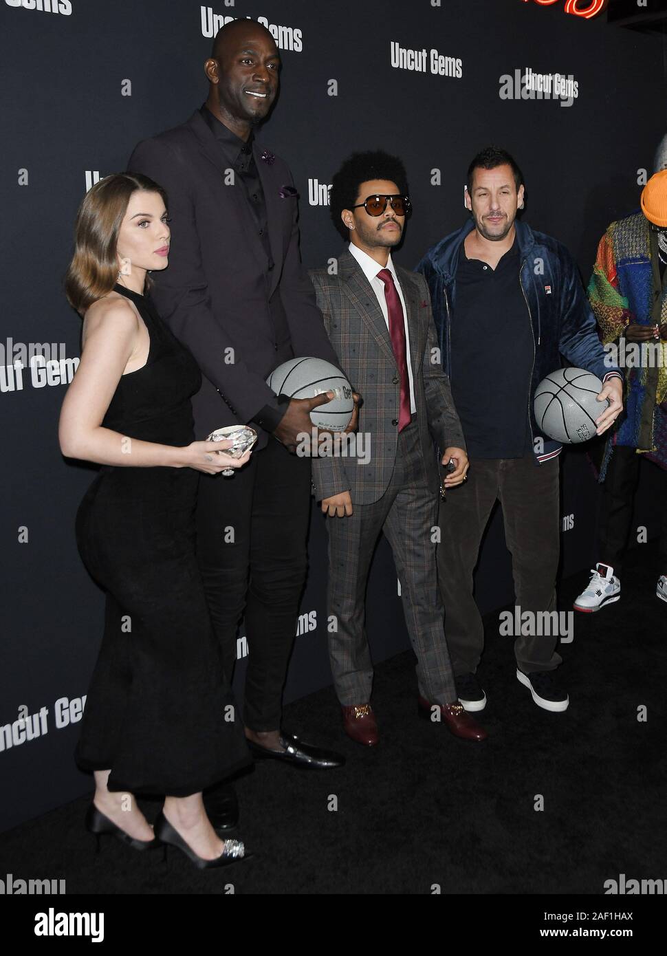 Los Angeles, USA. 11th Dec, 2019. (L-R) Julia Fox, Kevin Garnett, The Weeknd and Adam Sandler at the UNCUT GEMS Los Angeles Premiere held at the ArcLight Cinerama Dome in Los Angeles, CA on Wednesday, ?December 11, 2019. (Photo By Sthanlee B. Mirador/Sipa USA) Credit: Sipa USA/Alamy Live News Stock Photo