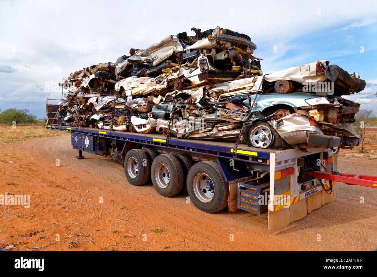 Crushed motor vehicles on truck trailer , West Kimberley, Western Australia Stock Photo