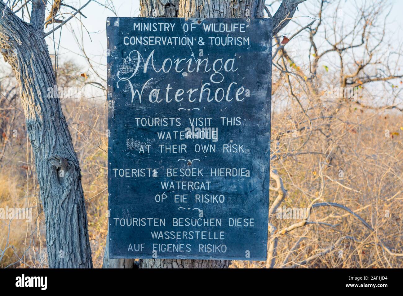 sign with information about waterhole for tourists, Halali camp, Etosha National Park, Namibia Stock Photo