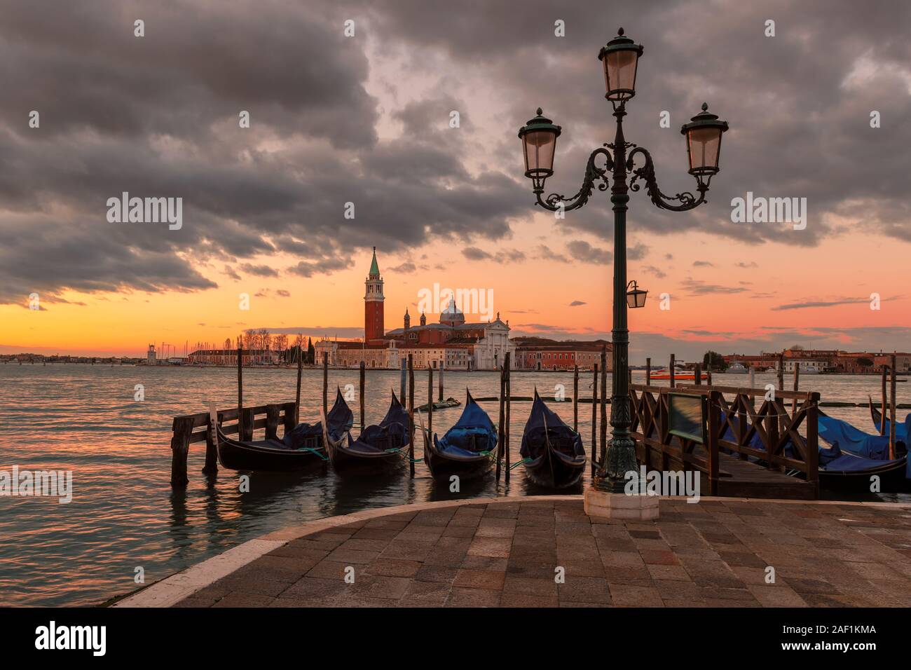Gondolas at Sunrise in Grand Canal, Venice, Italy. Stock Photo