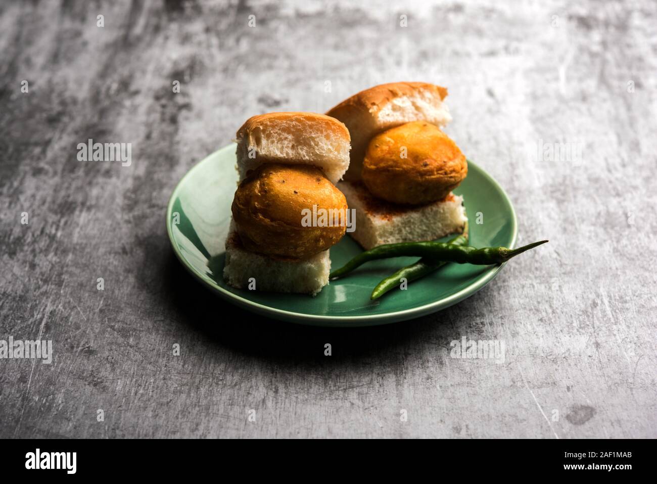 Egg Vada Pav or Anda  Wada Paav / Pao is a non-Vegetarian Fast Food Dish From Maharashtra, India Stock Photo