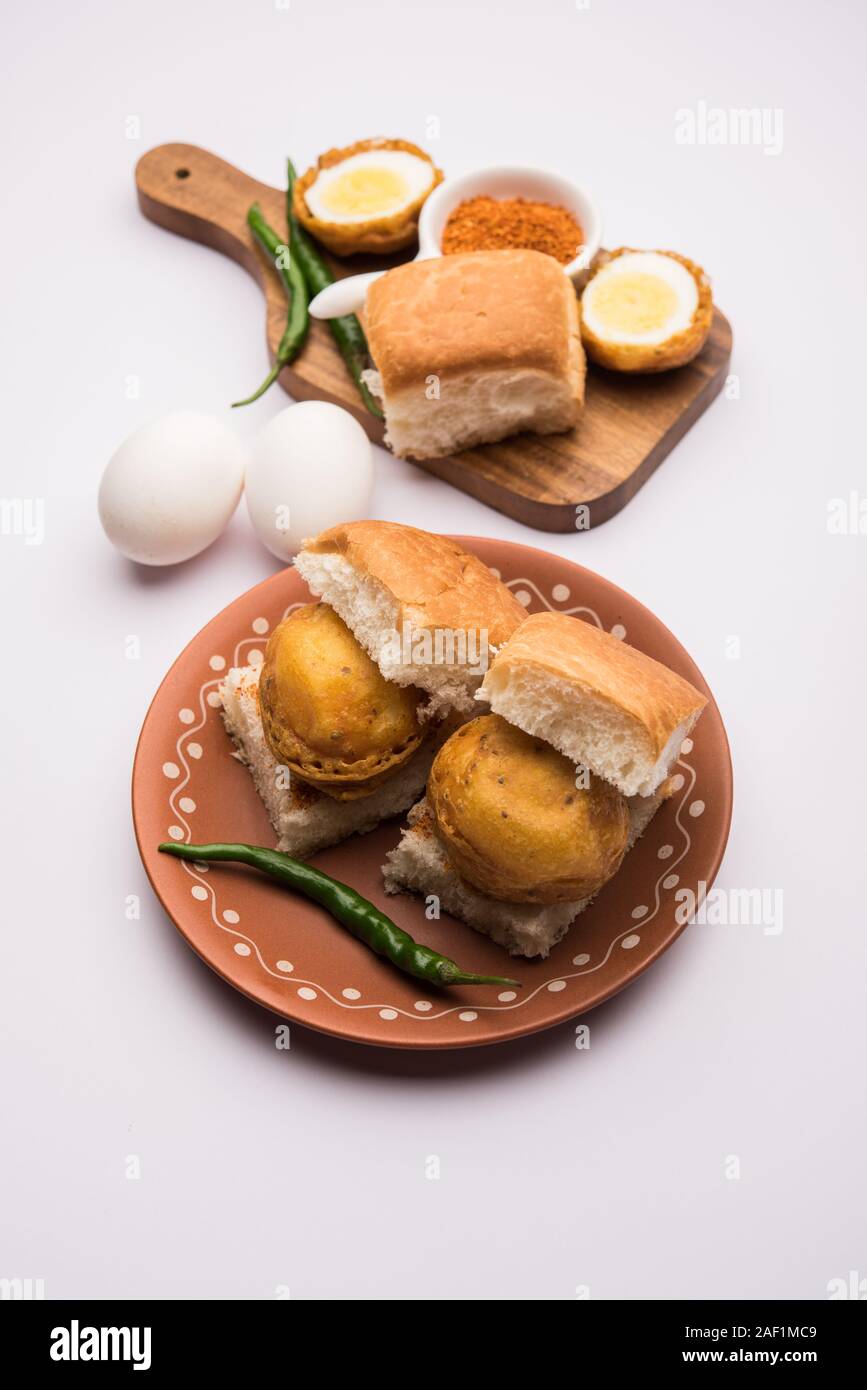 Egg Vada Pav or Anda  Wada Paav / Pao is a non-Vegetarian Fast Food Dish From Maharashtra, India Stock Photo