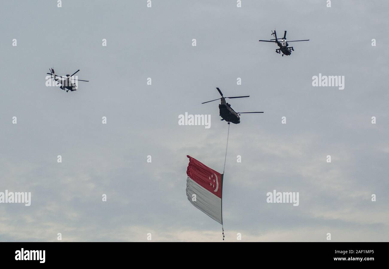 Singapore - Jul 4, 2015. Singapore Air Force (RSAF) fighter jets fly pass over Marina Bay Sands in Singapore National Day Parade (SG50) rehearsals. Stock Photo