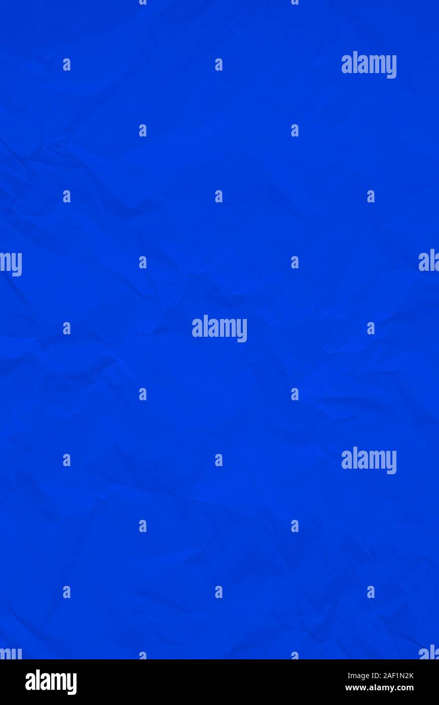 Dark blue crumpled wrinkled textured paper background. Empty space Stock Photo