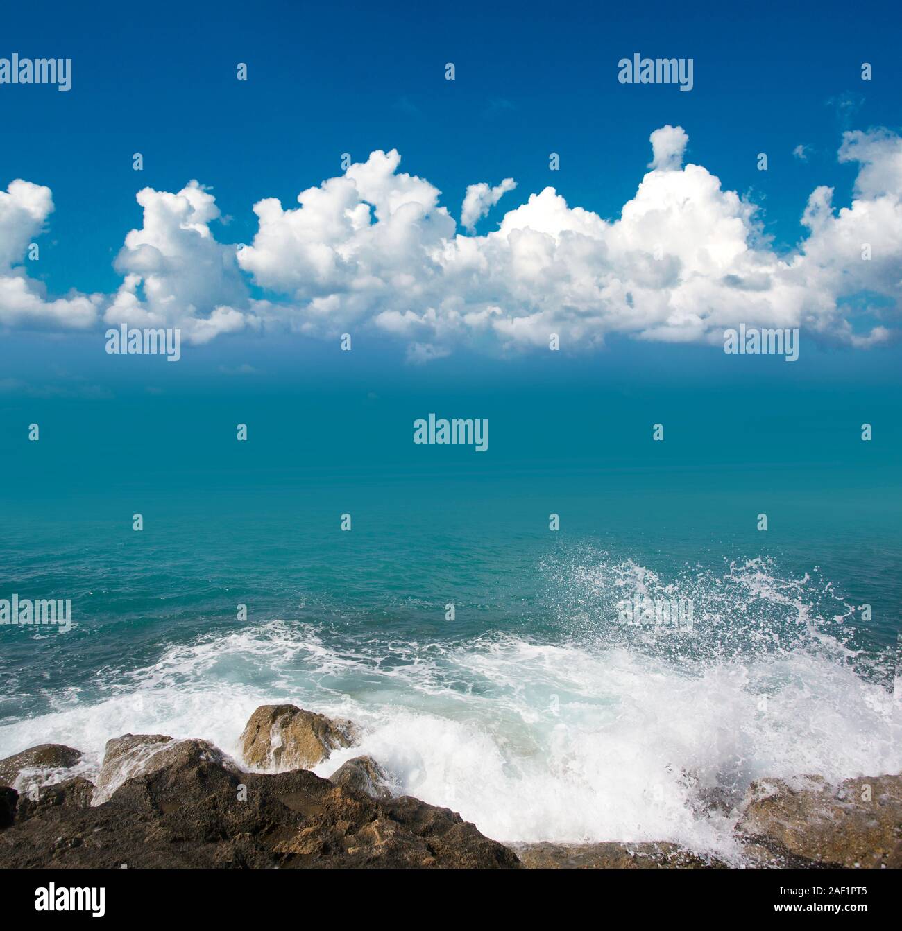 sea with waves and blue clouds sky background Stock Photo - Alamy