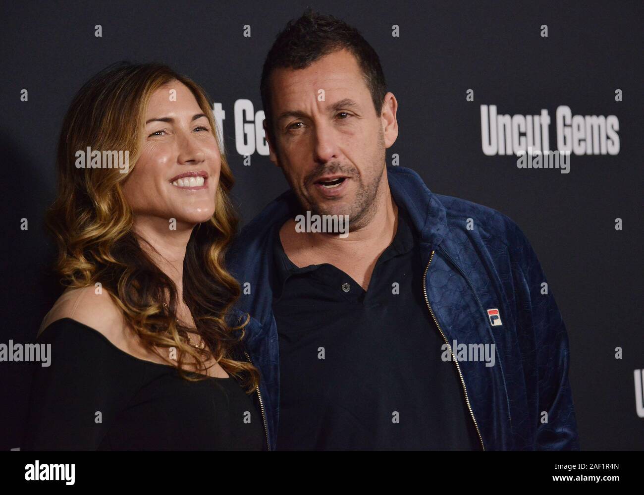 Los Angeles, USA. 11th Dec, 2019. Jackie Sandler and Adam Sandler arrives at the UNCUT GEMS Los Angeles Premiere held at the ArcLight Cinerama Dome in Los Angeles, CA on Wednesday, ?December 11, 2019. (Photo By Sthanlee B. Mirador/Sipa USA) Credit: Sipa USA/Alamy Live News Stock Photo