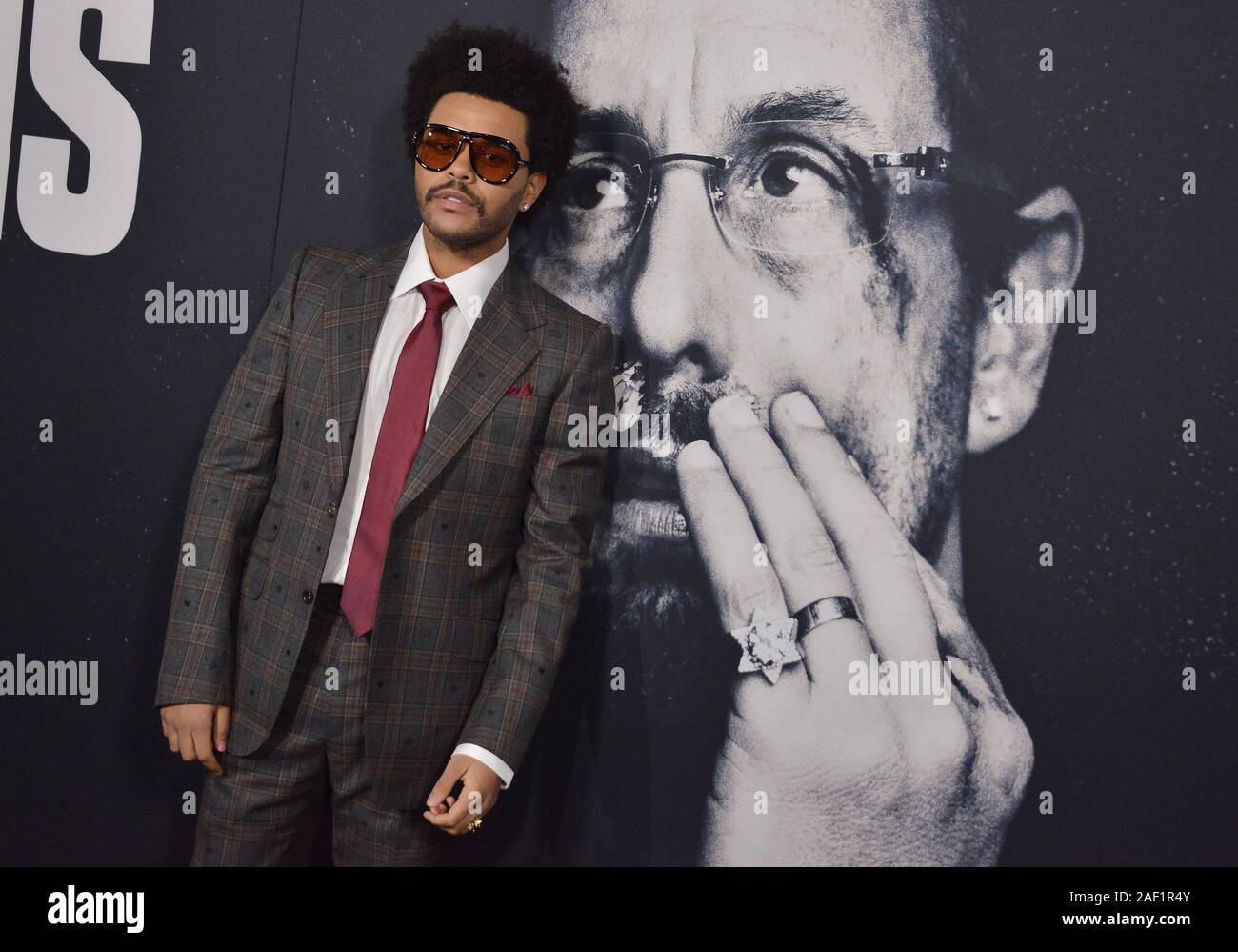 Los Angeles, USA. 11th Dec, 2019. The Weeknd arrives at the UNCUT GEMS Los Angeles Premiere held at the ArcLight Cinerama Dome in Los Angeles, CA on Wednesday, ?December 11, 2019. (Photo By Sthanlee B. Mirador/Sipa USA) Credit: Sipa USA/Alamy Live News Stock Photo