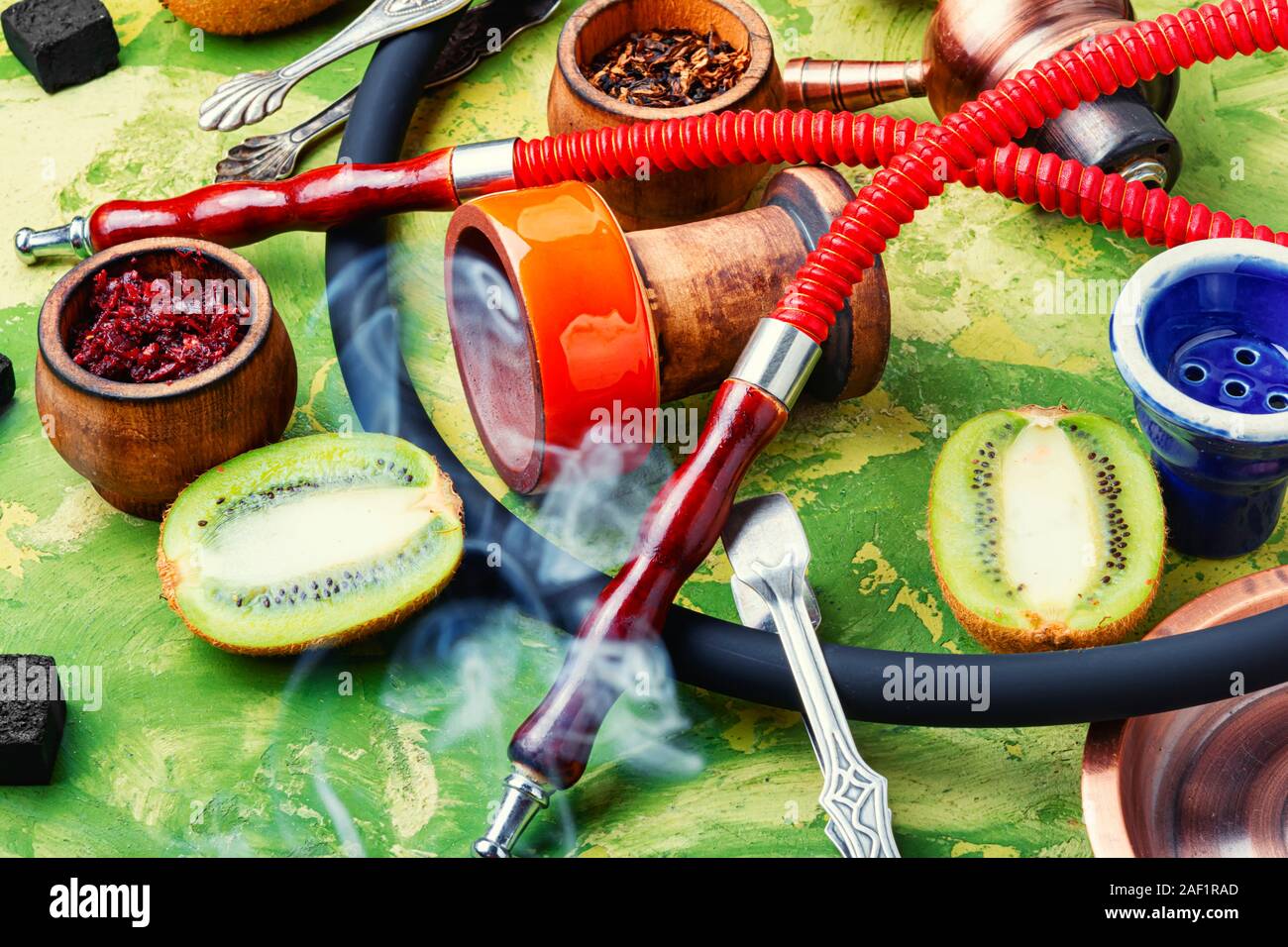 Arabic smoking hookah with taste of kiwi.Fruit shisha tobacco. Tobacco ...