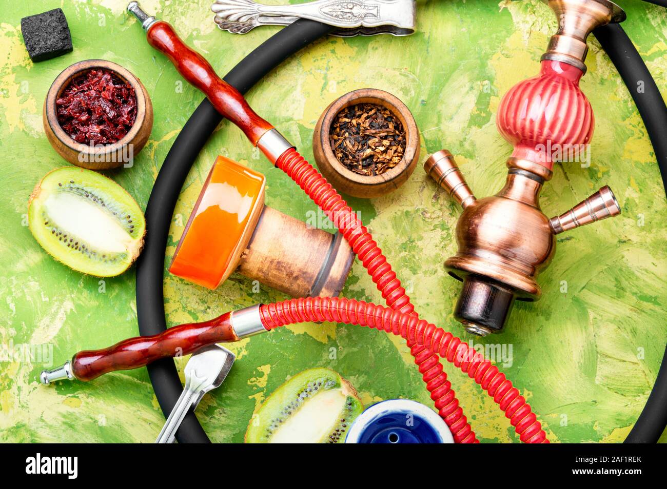 Arabic smoking hookah with taste of kiwi.Fruit shisha tobacco. Tobacco ...