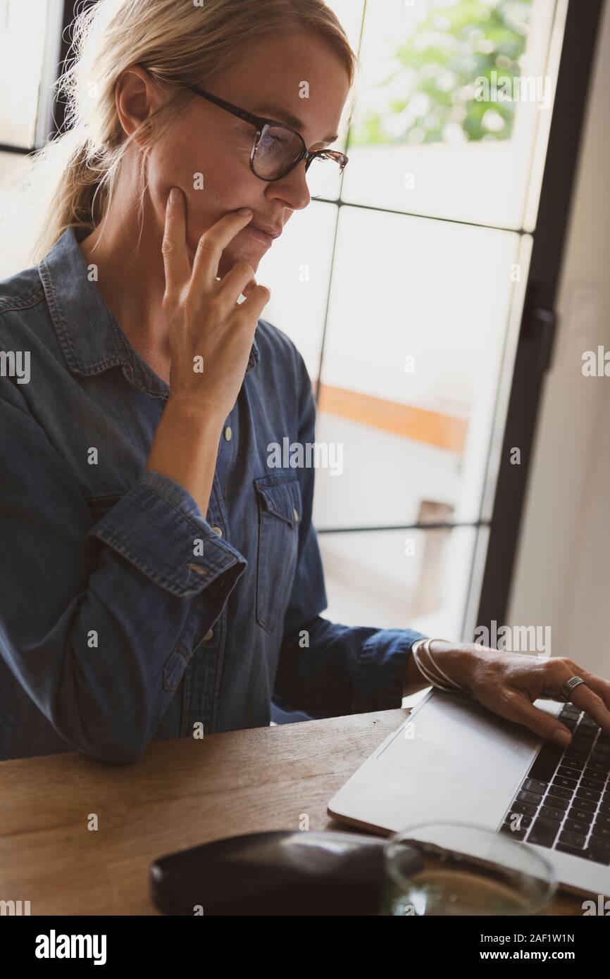Woman using laptop Stock Photo