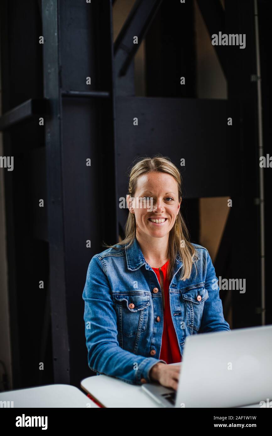 Woman working on laptop Stock Photo