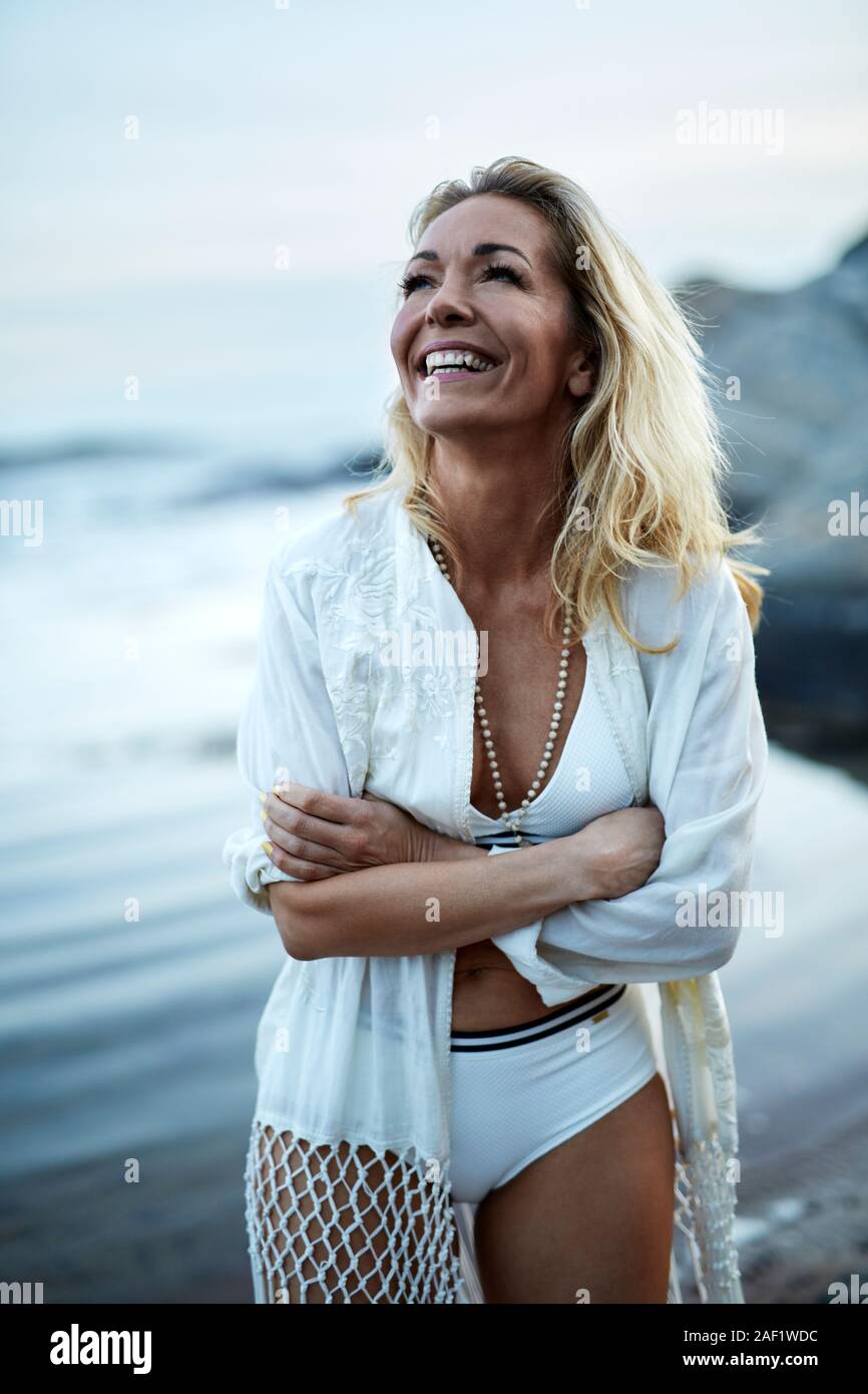 Happy woman on beach Stock Photo