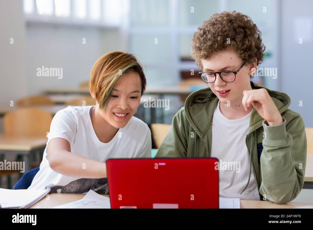 Teenagers in classroom Stock Photo - Alamy
