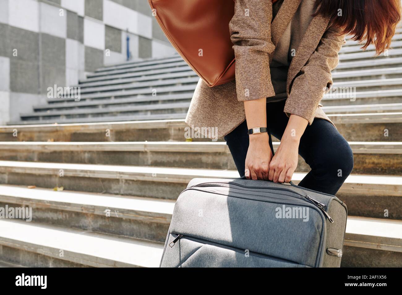Pulling suitcase up stairs hires stock photography and images Alamy