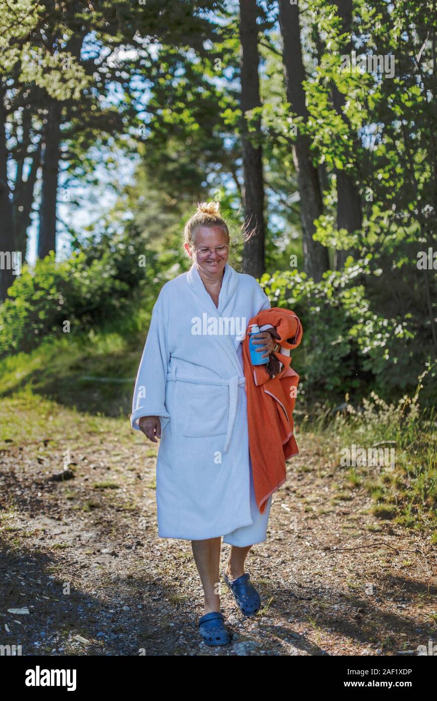 Woman wearing dressing gown holding towel Stock Photo Alamy