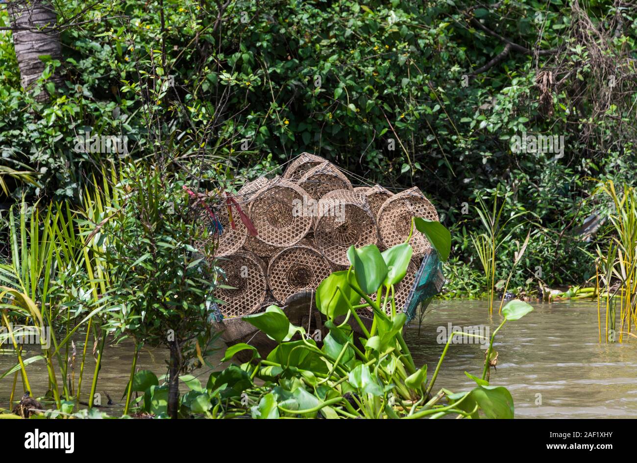 Woven bamboo fishing baskets for catching eels on small Boat Mekong