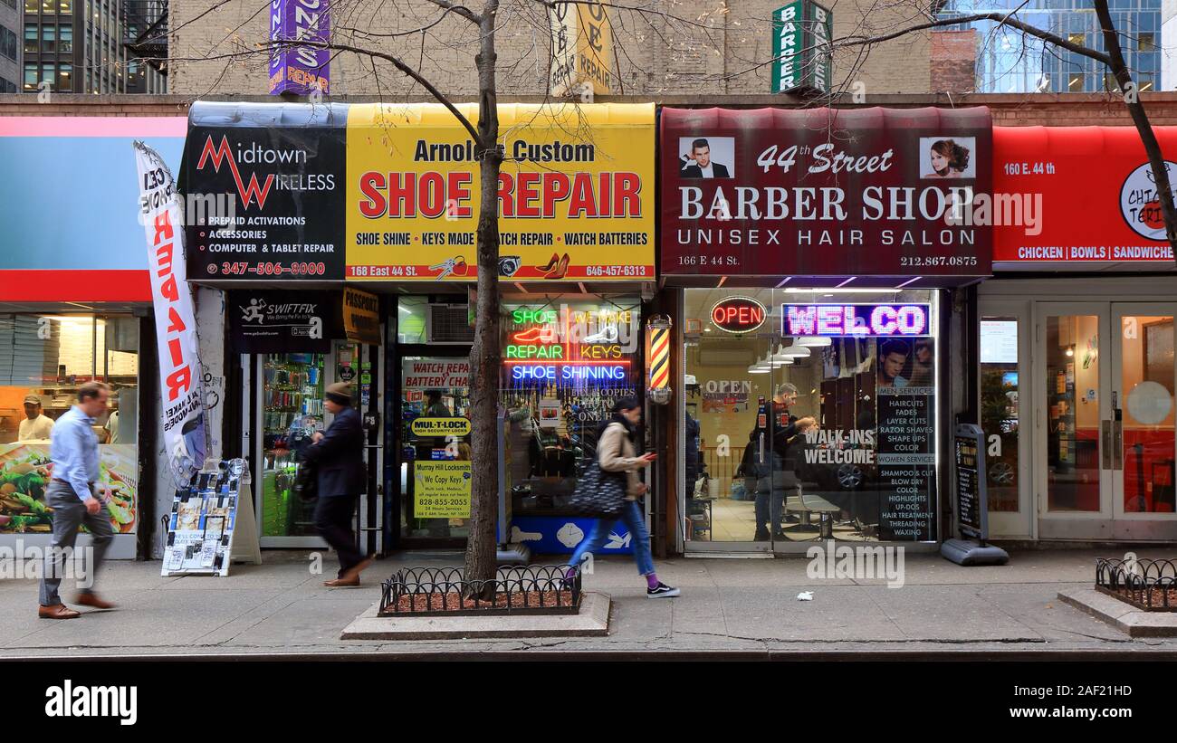 Small business storefronts along East 44th St in Midtown Manhattan, New York, NY. essential small business services that office workers may need. Stock Photo