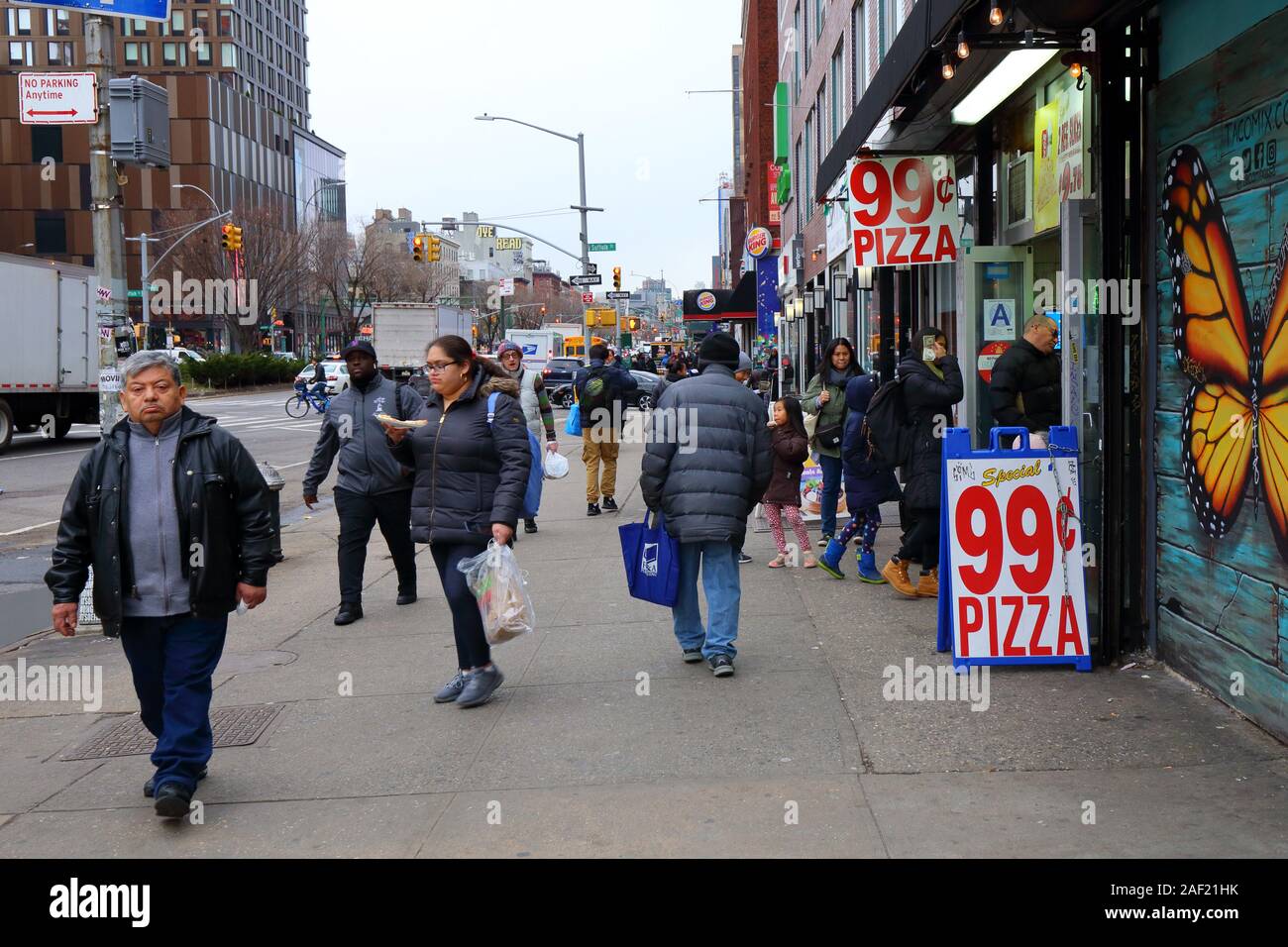 People walking along Delancey Street, Lower East Side, New York, NY. (december 2019 Stock Photo