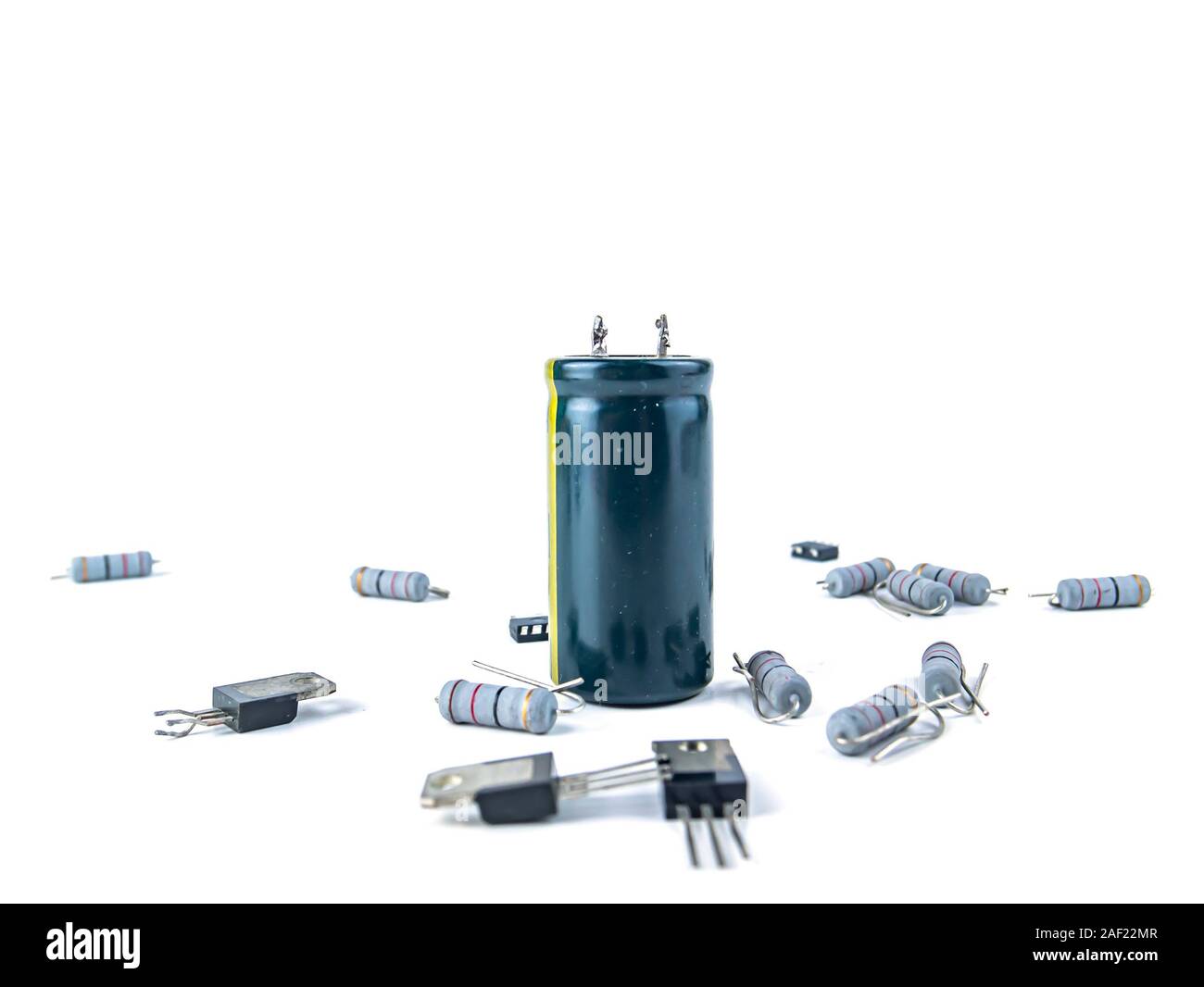 Electronic parts on a white background with place for text. Capacitor