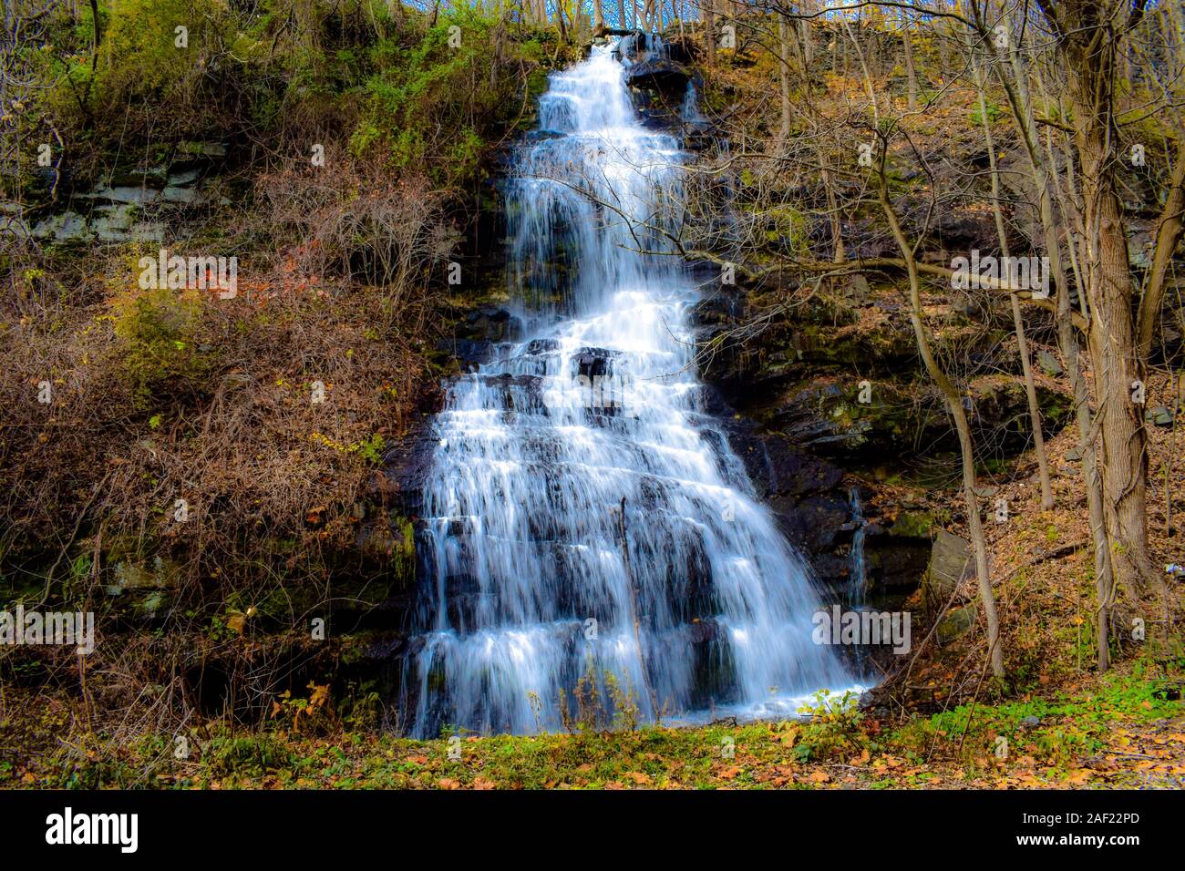 Colorful Waterfall flowing down The Mountain Side Stock Photo