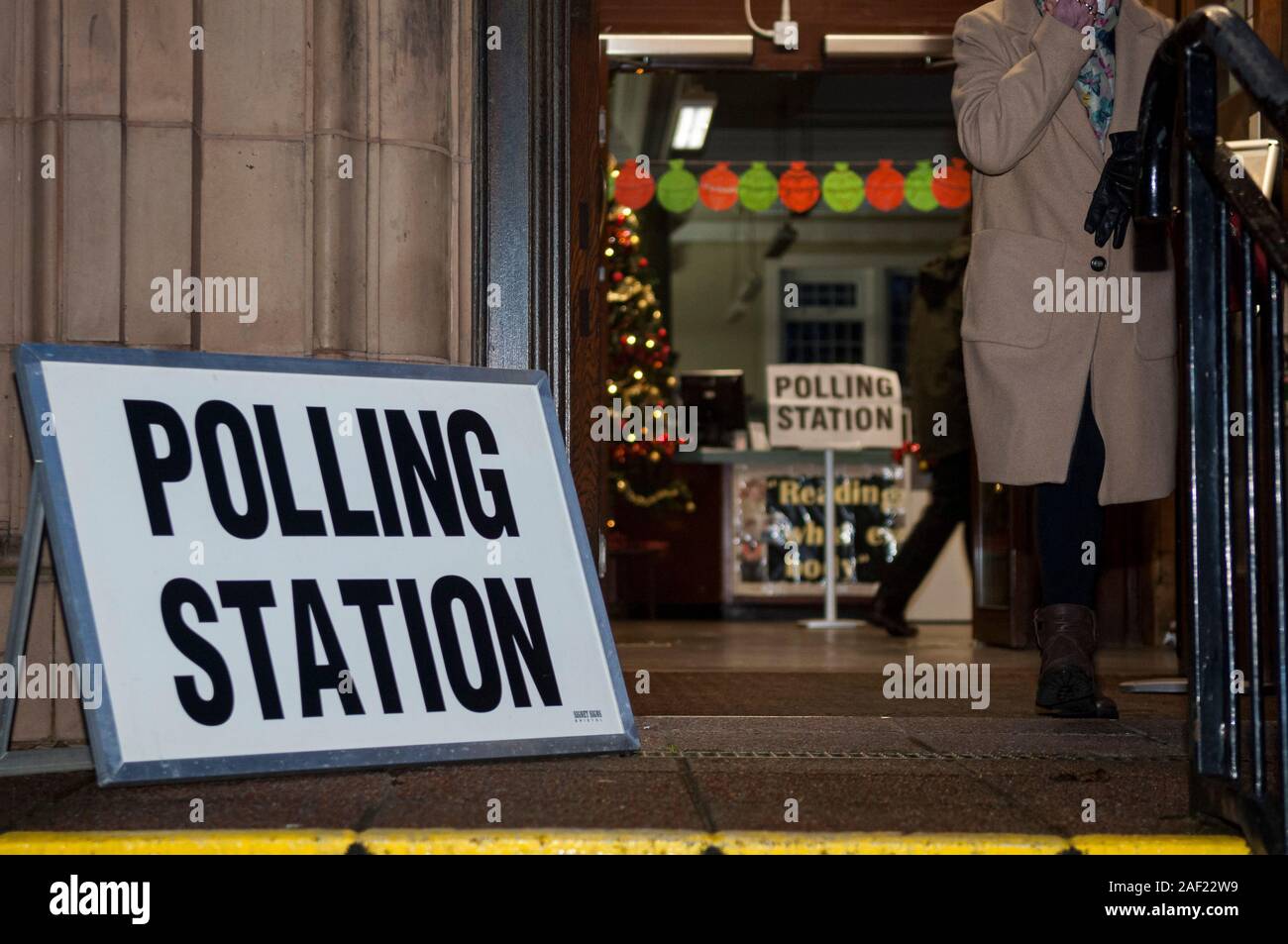 Wirral, UK. 12th December 2019. An early, busy start to voting, as polling stations open across the UK in the general election, the first to be held in December since 1923. Pictured is a festive looking polling station with a Christmas tree in the background.  Credit: Paul Warburton/Alamy Live News Stock Photo