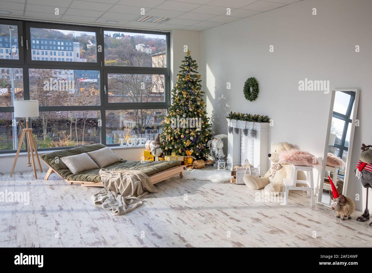 Interior of christmas decorated living room with christmas tree and big window Stock Photo