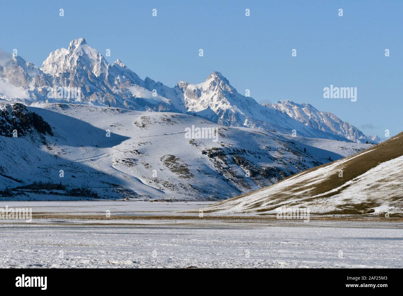 Overview over National Elk Refuge with Grand Teton Range in background on a nice winter day, Jackson Hole, Wyoming, USA. Stock Photo