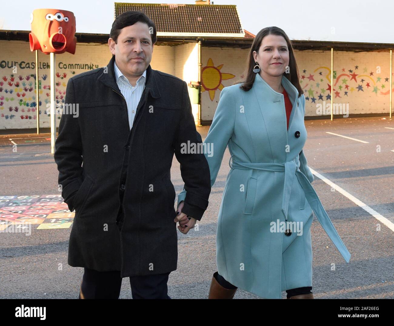 Liberal Democrat leader Jo Swinson and her partner Duncan Hames arrive to cast their votes in the 2019 General Election at Castlehill Primary School in Glasgow. Stock Photo