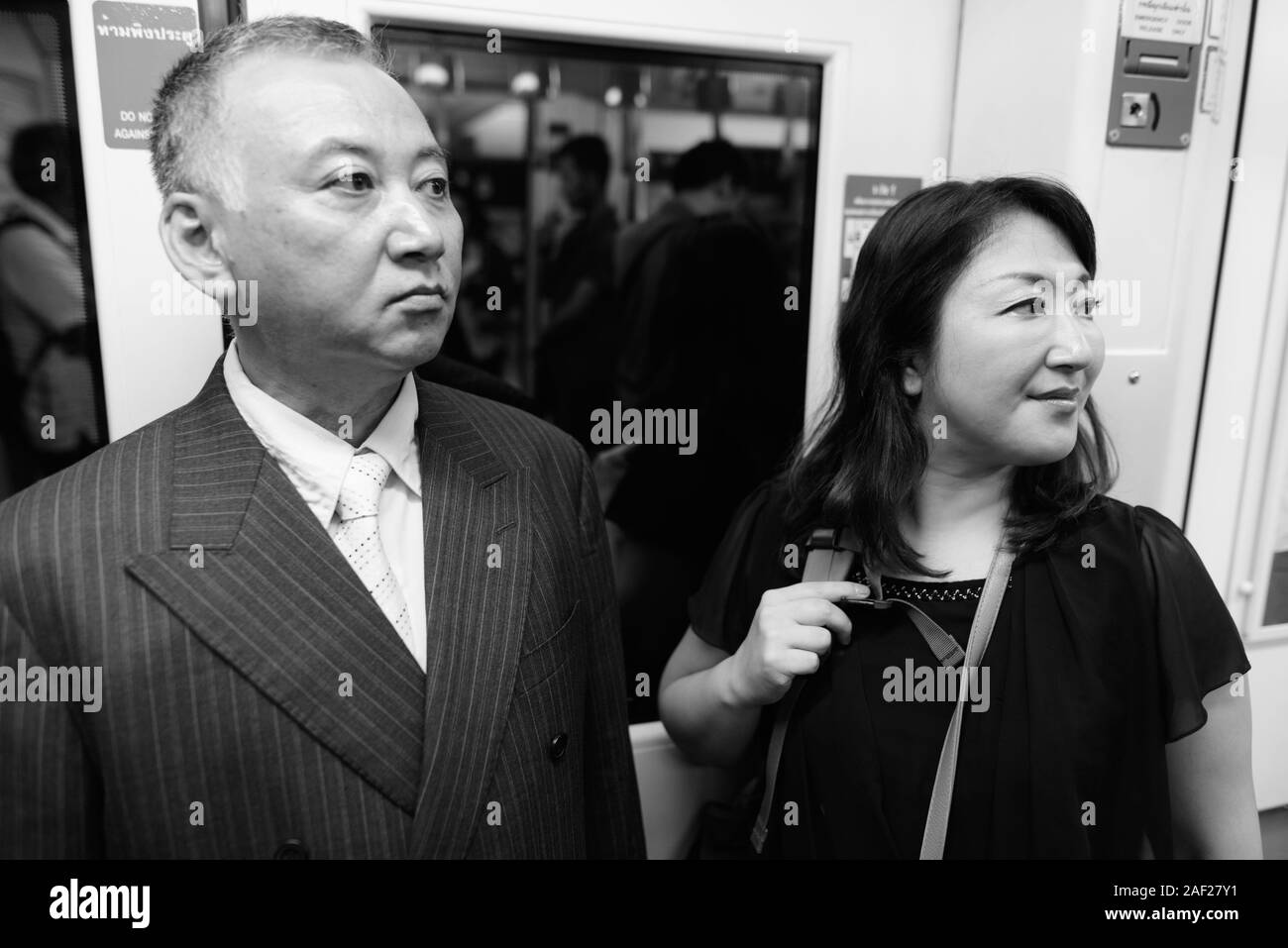 Asian man woman subway hi-res stock photography and images - Alamy