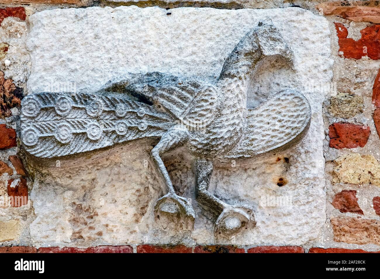 Italy Emilia Romagna Codigoro - Pomposa Abbey - symbolisms and external details - peacock Stock Photo