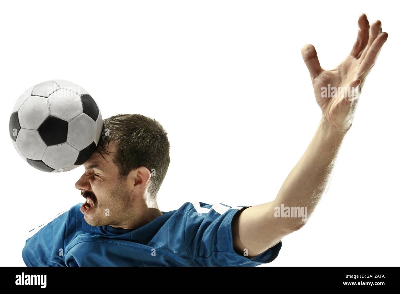Soccer player heads ball on hi-res stock photography and images