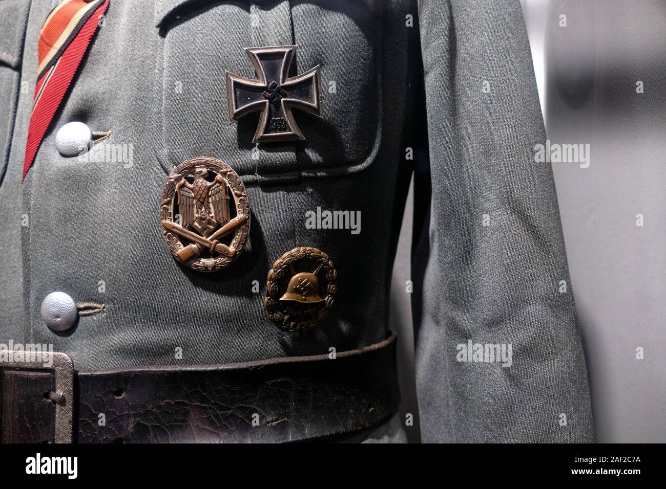 The remains of a Nazi uniform including the Iron Cross medal. Stalag Luft III - Stammlager Luft III near the Polish town of Sagan in Lower Silesia. Th Stock Photo