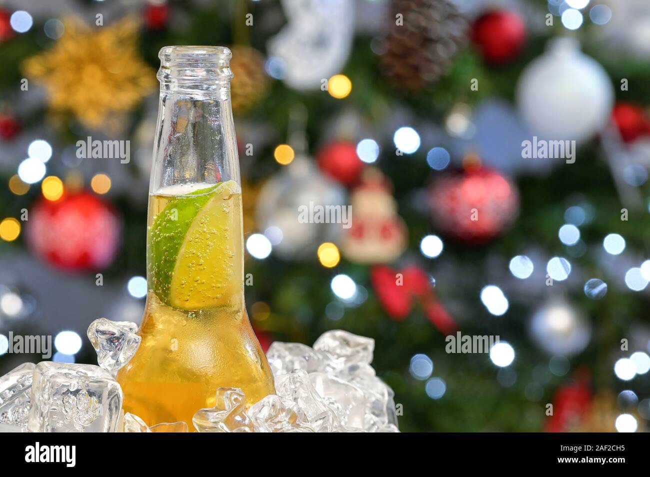 Beer With Lime Slice and Holiday background Stock Photo