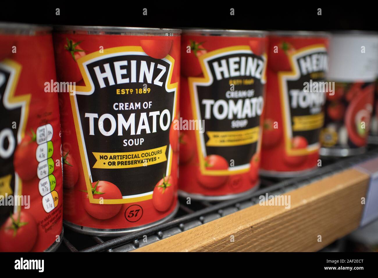 Tins of the Famous Heinz Tomato Soup sauce sat on a supermarket shelf. H. J. Heinz Company