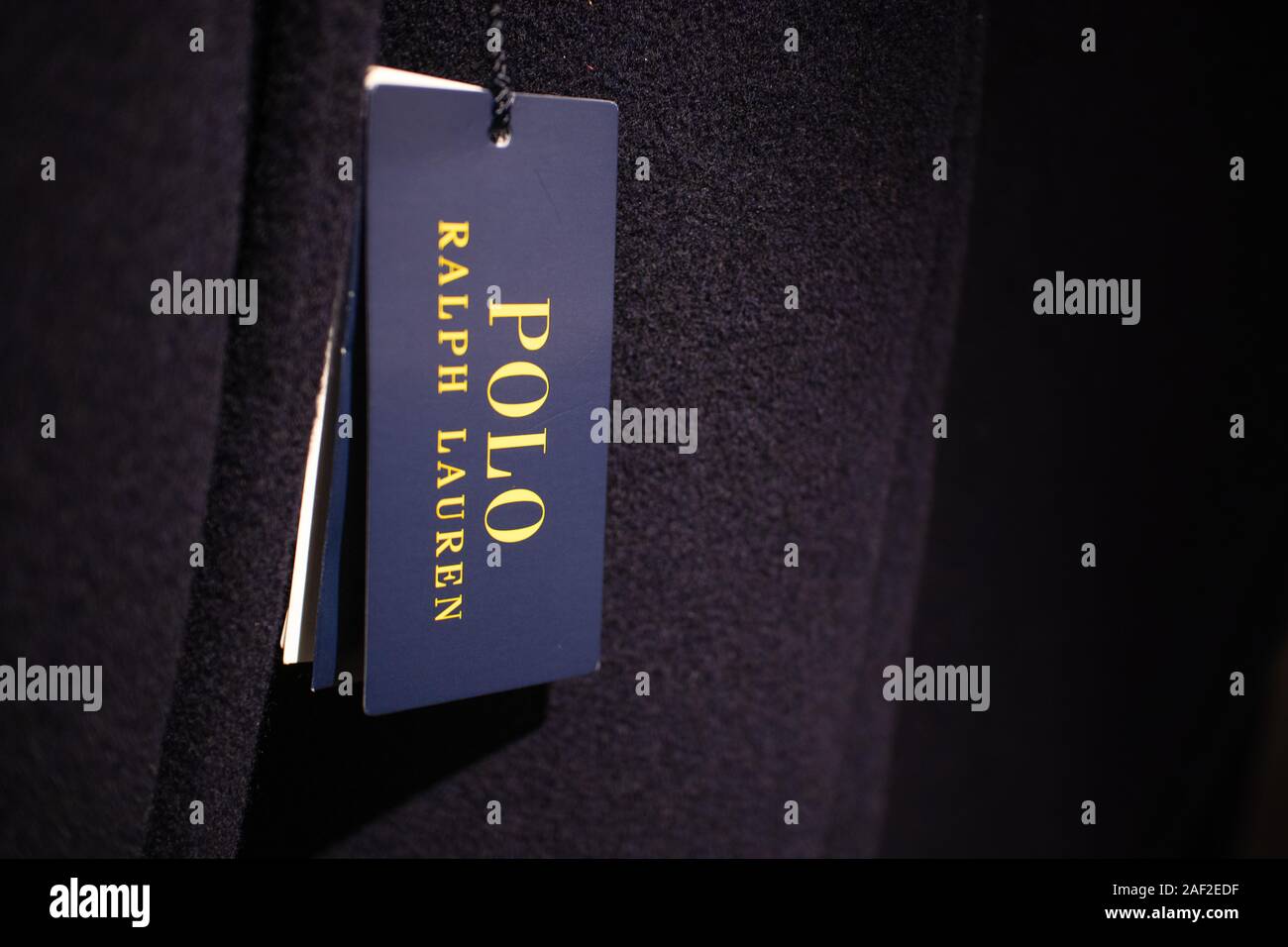 Luxury designer label of Polo Ralph Lauren clothes ticket hanging from a  mens suit. Fading out to black. Easy to extend for a banner Stock Photo -  Alamy