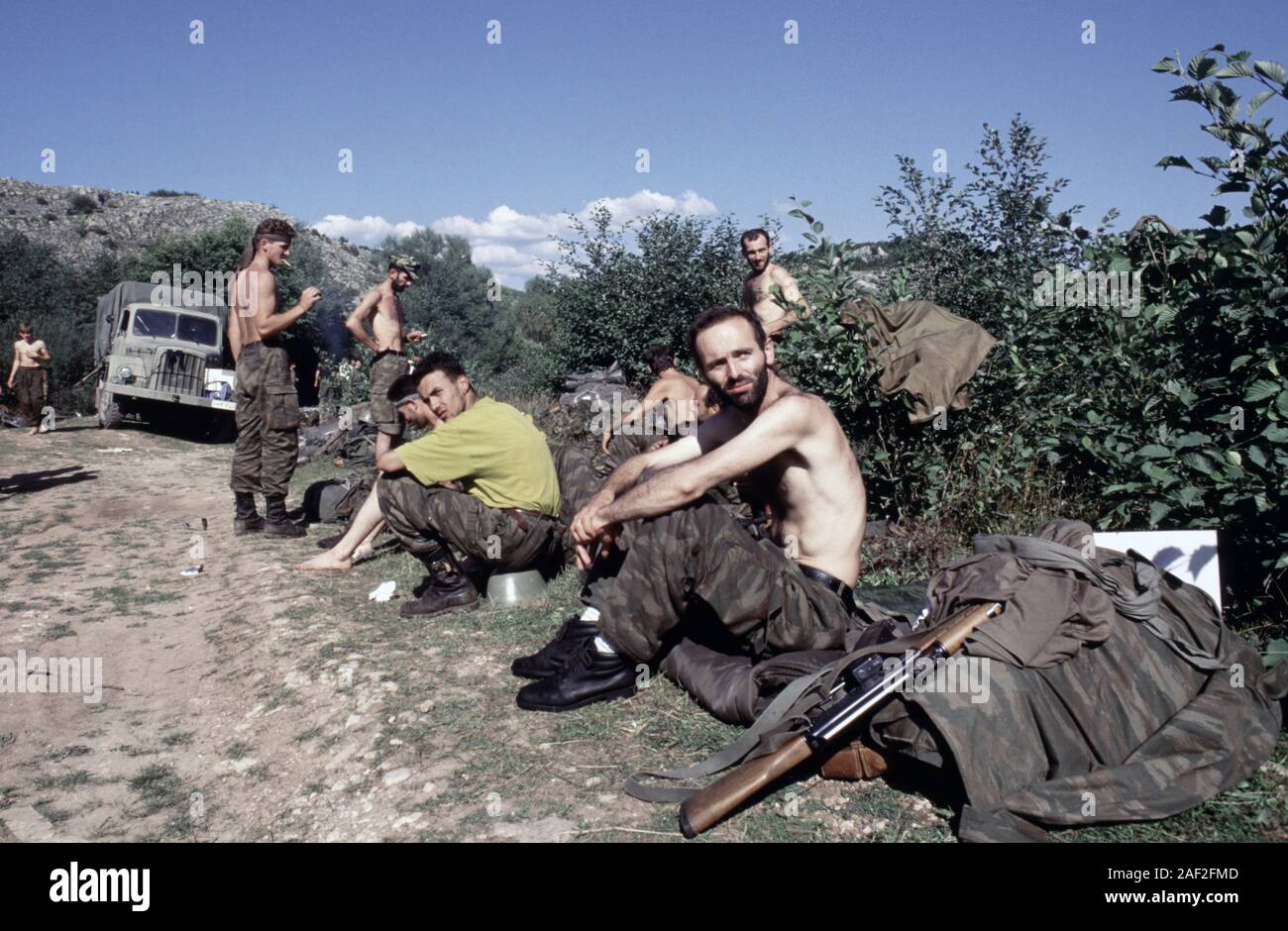 13th August 1993 During the war in Bosnia: BSA (Bosnian-Serb) soldiers relax in the hot sun on Bjelašnica mountain after intense fighting with ARBiH forces. Stock Photo