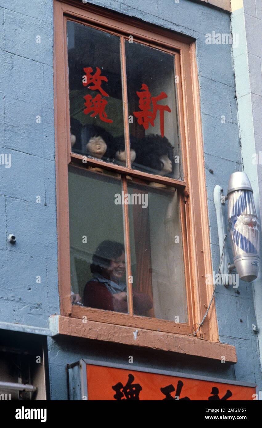 Chinese hairdresser and barber in Chinatown, Soho, London, 80s Stock