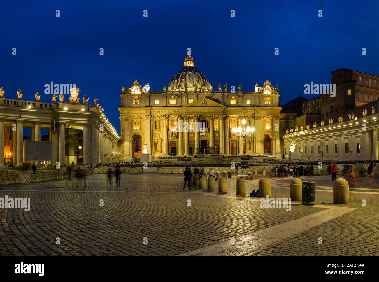 The Papal Basilica of St. Peter, St. Peter's Basilica, seen from St. Peter's Square, illuminated at night Stock Photo