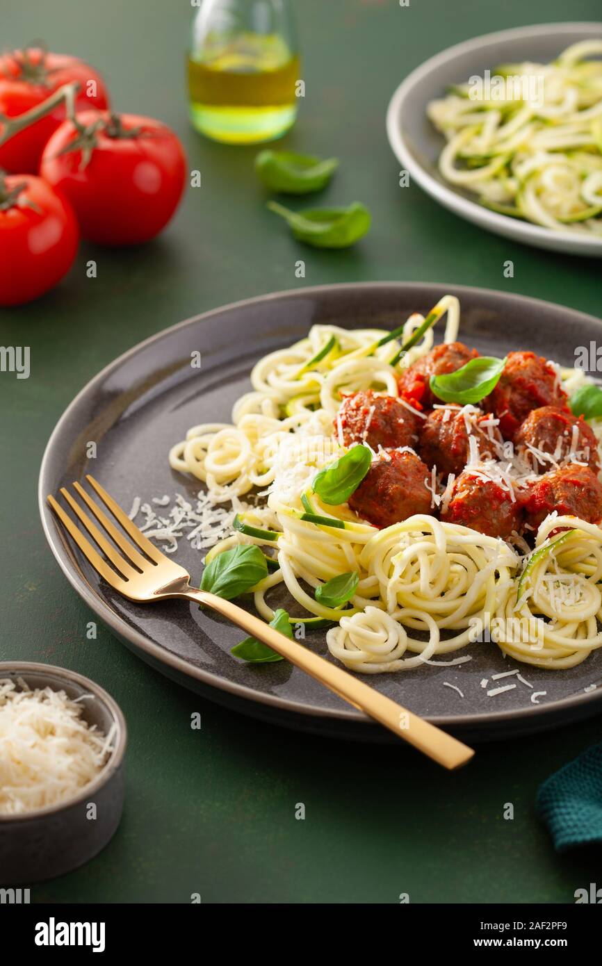 keto paleo diet zoodles spiralized zucchini noodles with meatballs and parmesan Stock Photo