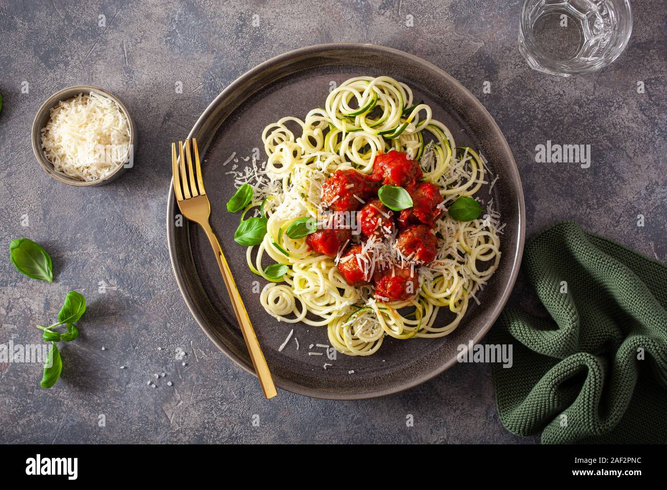 keto paleo diet zoodles spiralized zucchini noodles with meatballs and parmesan Stock Photo