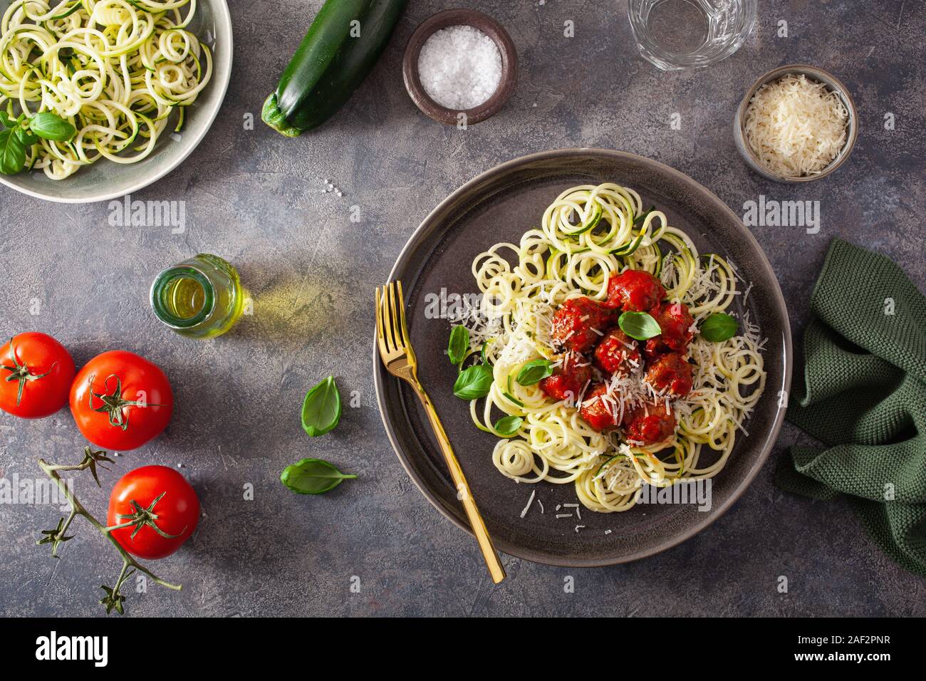 keto paleo diet zoodles spiralized zucchini noodles with meatballs and parmesan Stock Photo