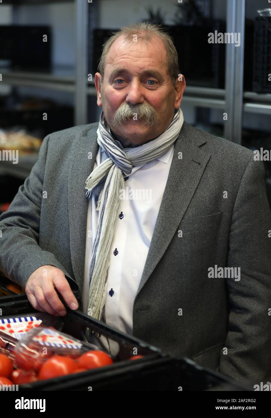 Mechernich, Germany. 12th Dec, 2019. Wolfgang Weilerswist, Chairman of the North Rhine-Westphalian State Association of Tafel, stands in the issuing office of Tafel Mechernich. Credit: Oliver Berg/dpa/Alamy Live News Stock Photo